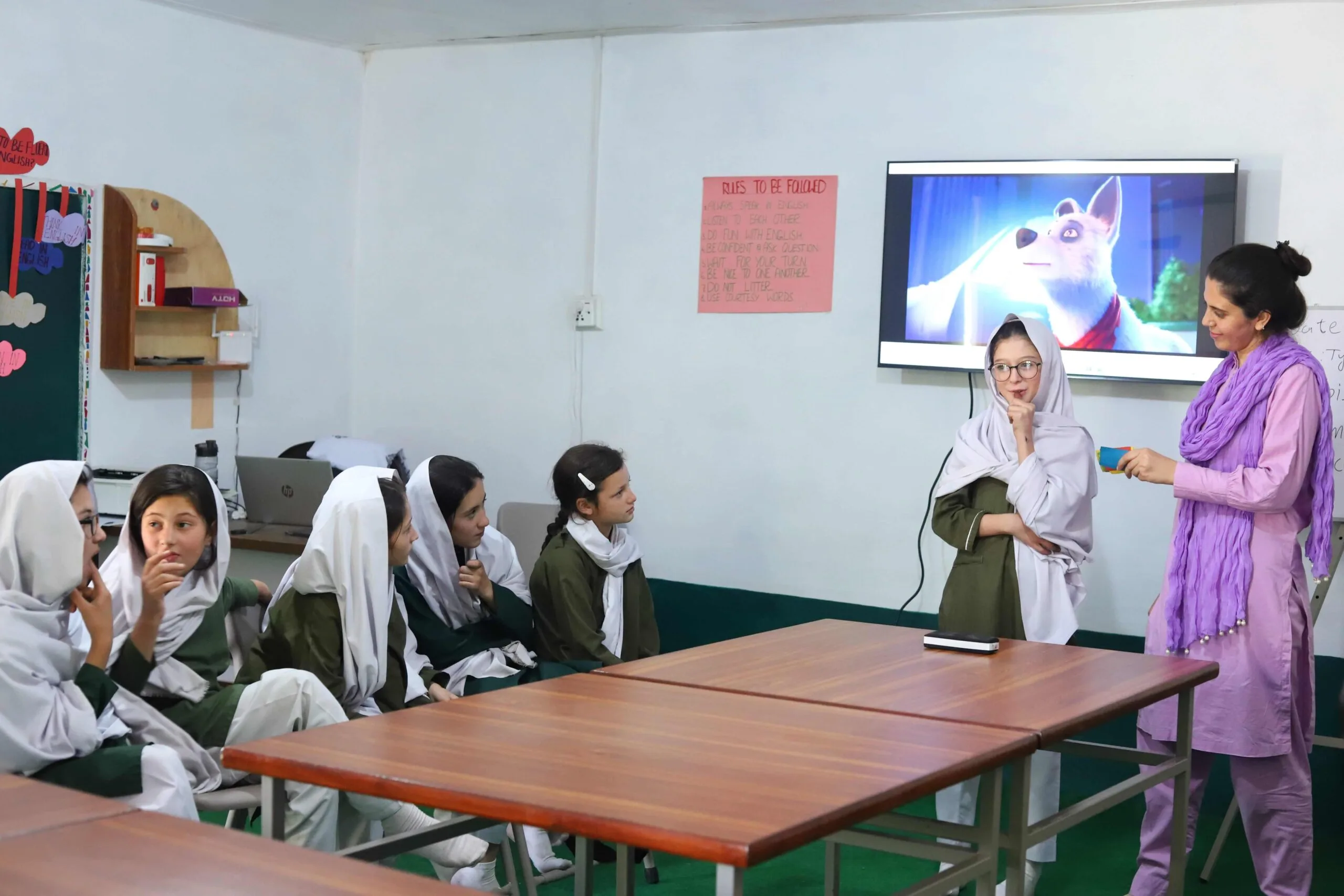 FES Projects - Teacher in the classroom helping students